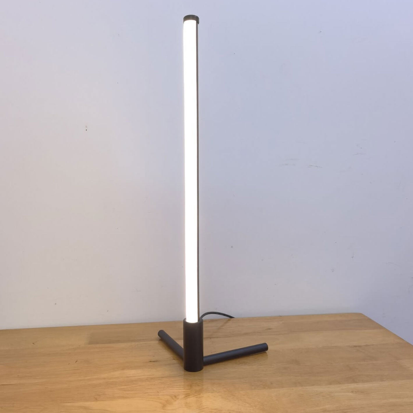 Minimalist LED Table Lamp with Adjustable Light Settings