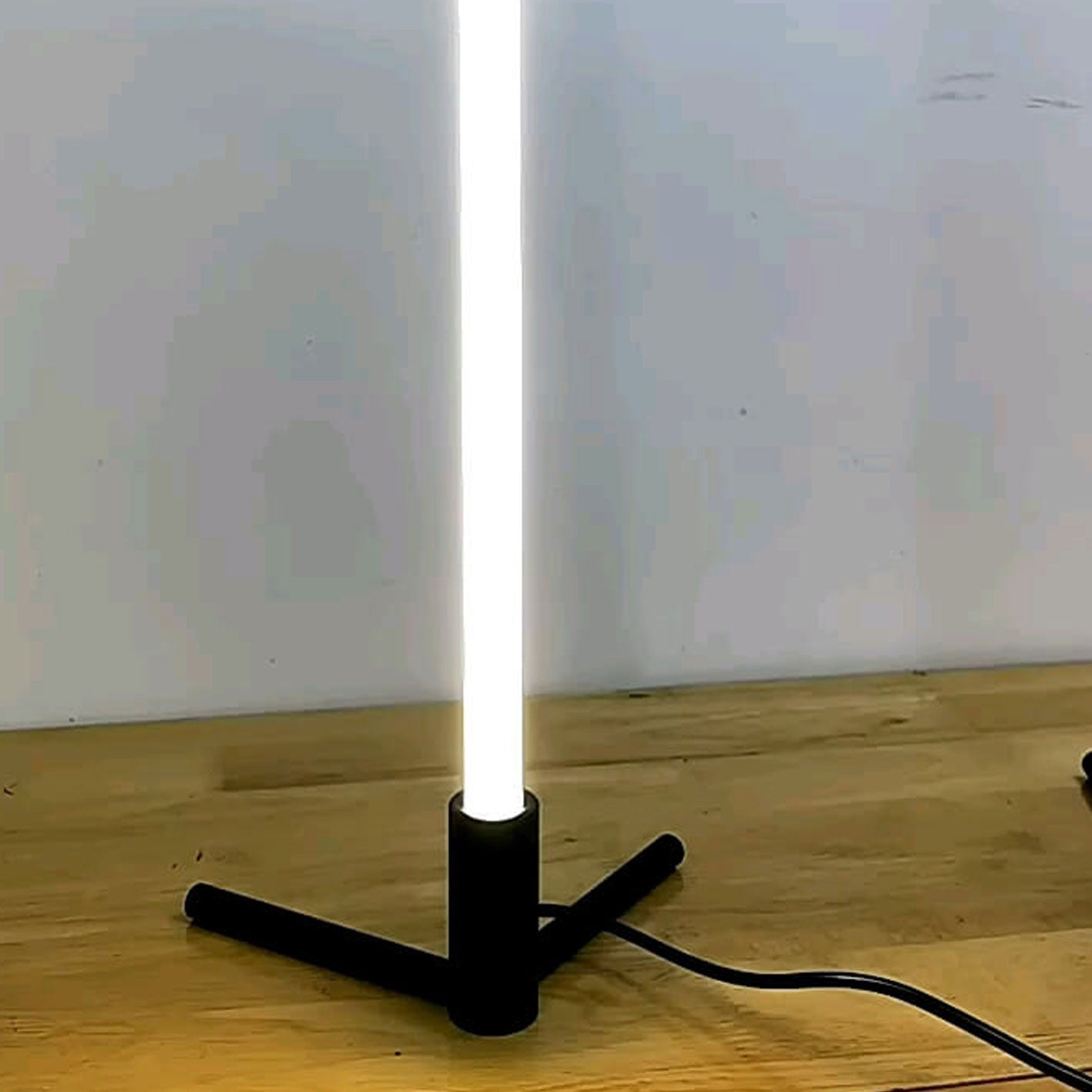 Minimalist LED Table Lamp with Adjustable Light Settings