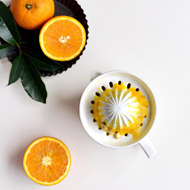 Ceramic Manual Citrus Juicer - Elegant White Design