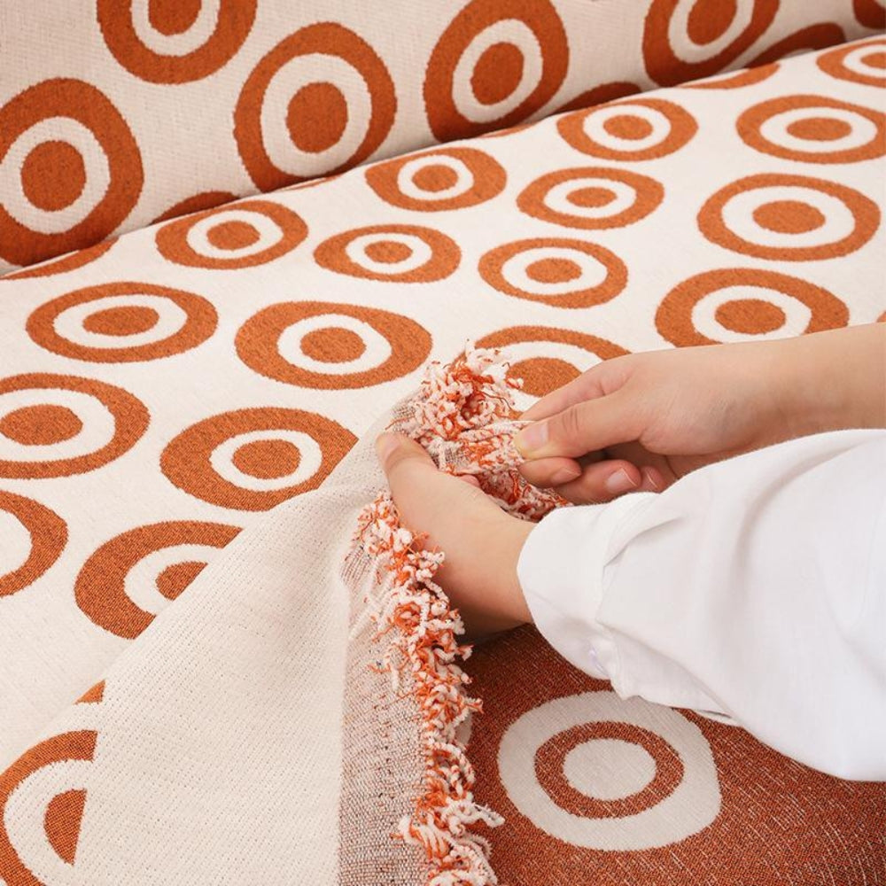 Chenille Sofa Cover with Circular Pattern and Tassel Accents