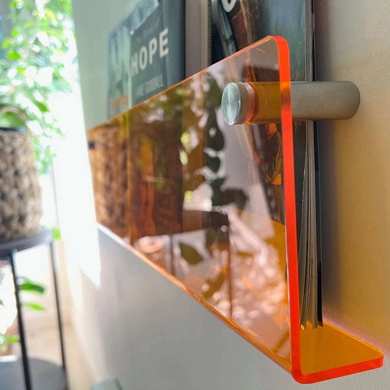 Acrylic Wall-Mounted Floating Magazine Rack in Clear and Orange