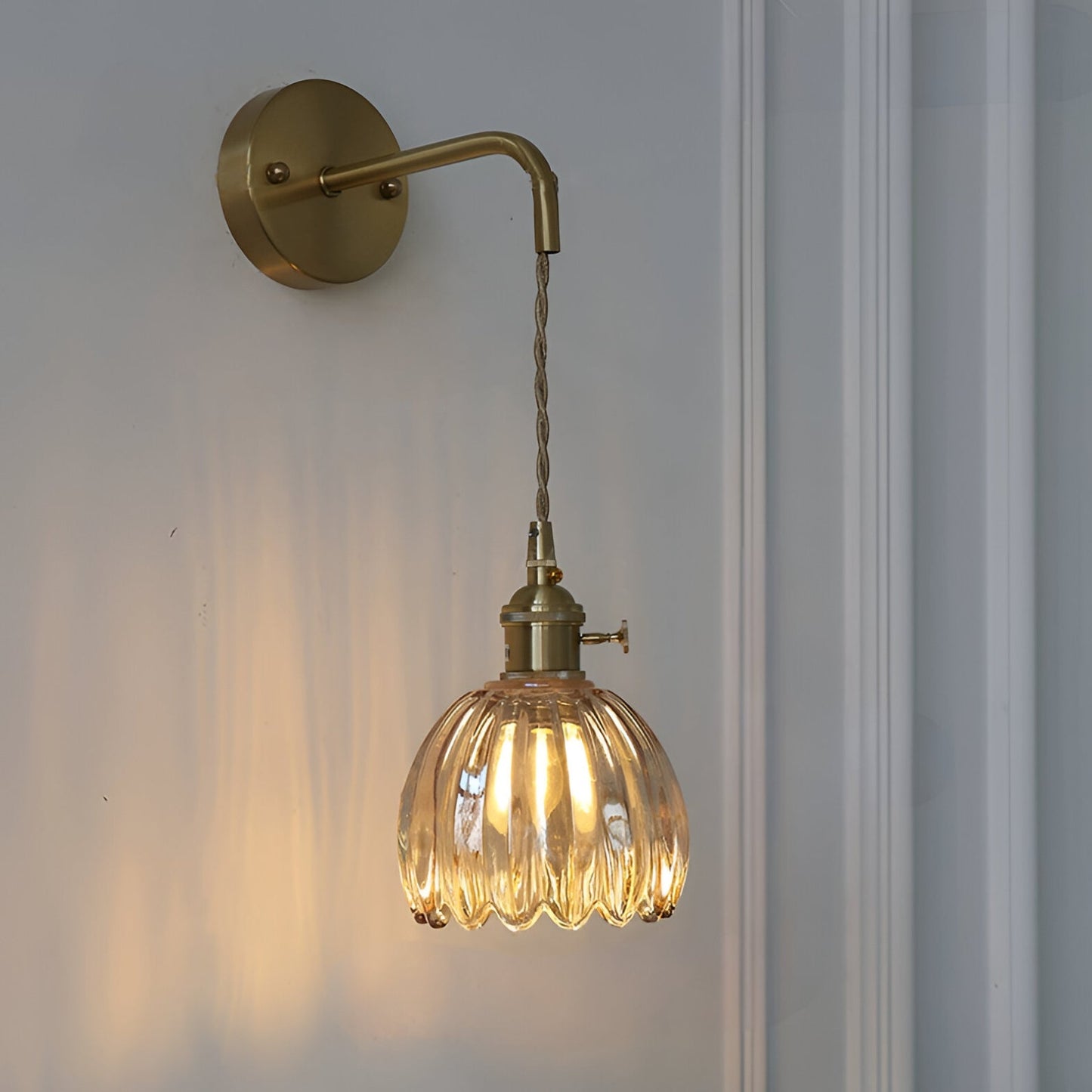 Modern Pink Ribbed Glass Wall Sconce with Brushed Gold Finish