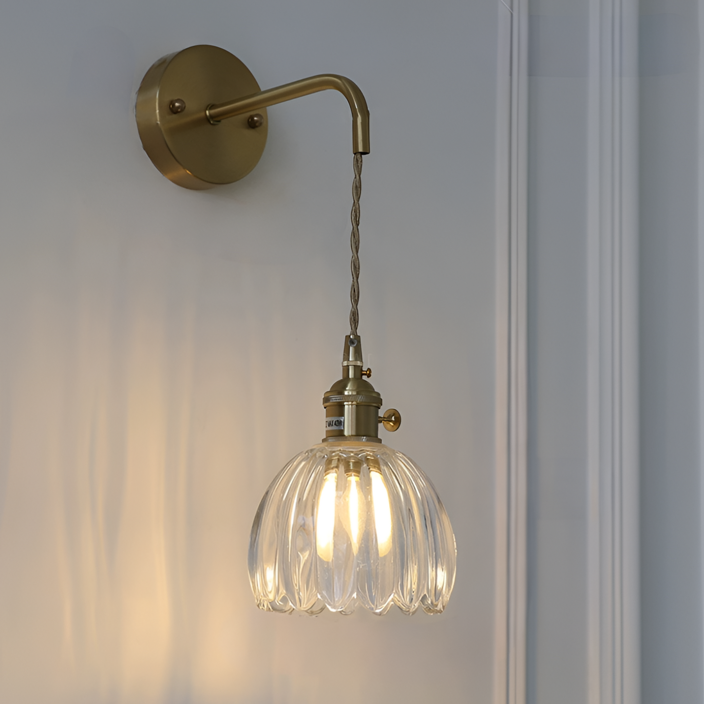 Modern Pink Ribbed Glass Wall Sconce with Brushed Gold Finish