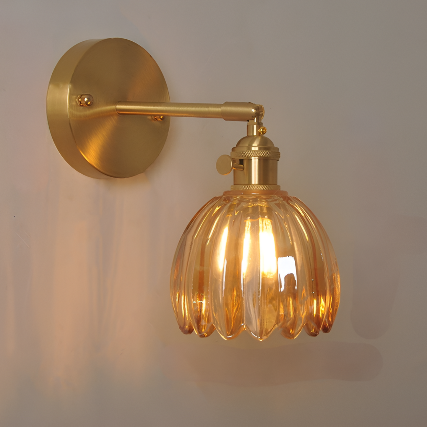 Modern Pink Ribbed Glass Wall Sconce with Brushed Gold Finish
