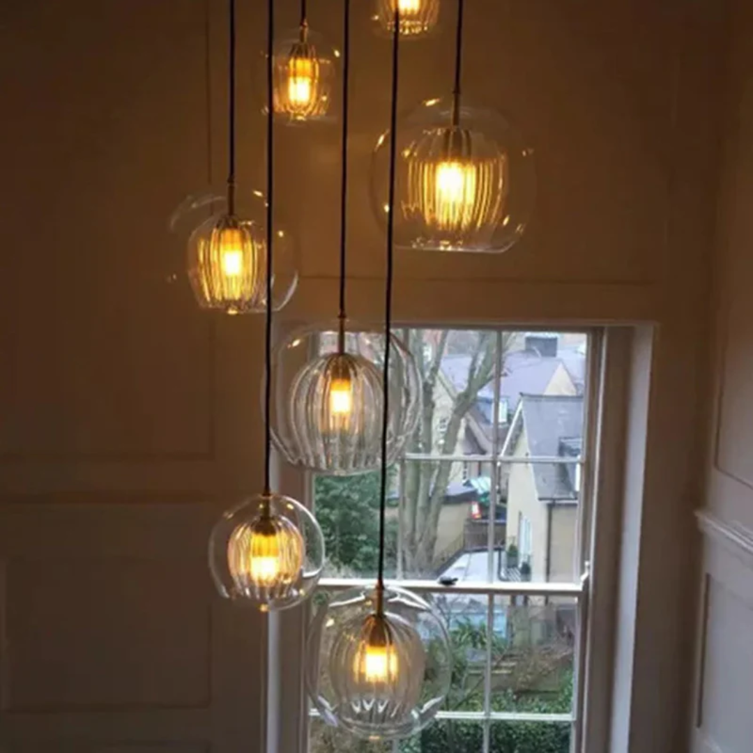 Modern Adjustable Spherical LED Pendant Light in Clear or Amber Glass