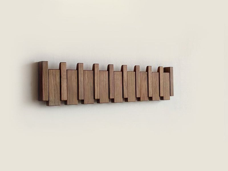 Piano-Inspired Wooden Coat Rack with Foldable Hooks